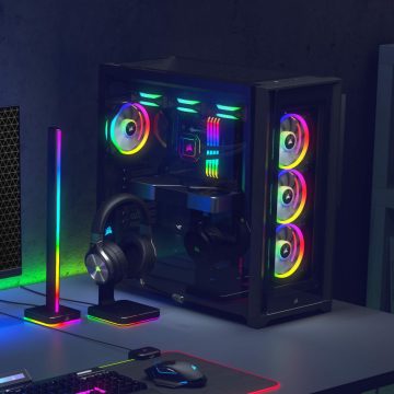 PC tower, lamp, and headphone stand with colorful Philips Hue gaming lights