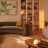 A living room decorated in neutral colours and lit with white light.