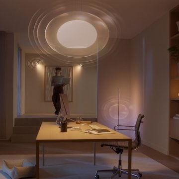 A person entering a room set up with a Hue MotionAware motion area for motion detection.