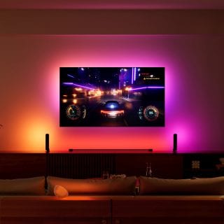 TV playing a racing game in living room with pink and red lights