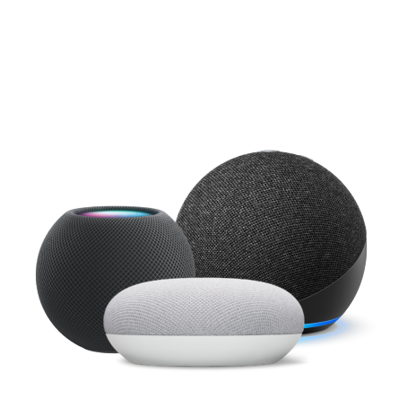 Close up of Apple HomePod Mini, Google Nest Mini and Amazon Echo Dot on white background