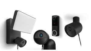 A Hue floodlight camera, wired 2K camera, 2K battery camera, and Hue Secure video doorbell camera in black. 