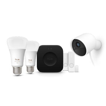 Twee slimme Philips Hue lampen, een Hue Bridge Pro, twee Hue contactsensoren en een witte, bedrade Hue Secure camera. 