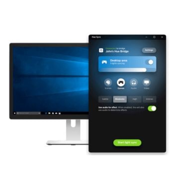 Monitor com a tela ligada e efeitos sincronizados com o app Hue Sync para desktop