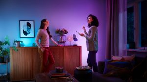 Couple using Amazon Alexa to turn on Philips Hue smart lights